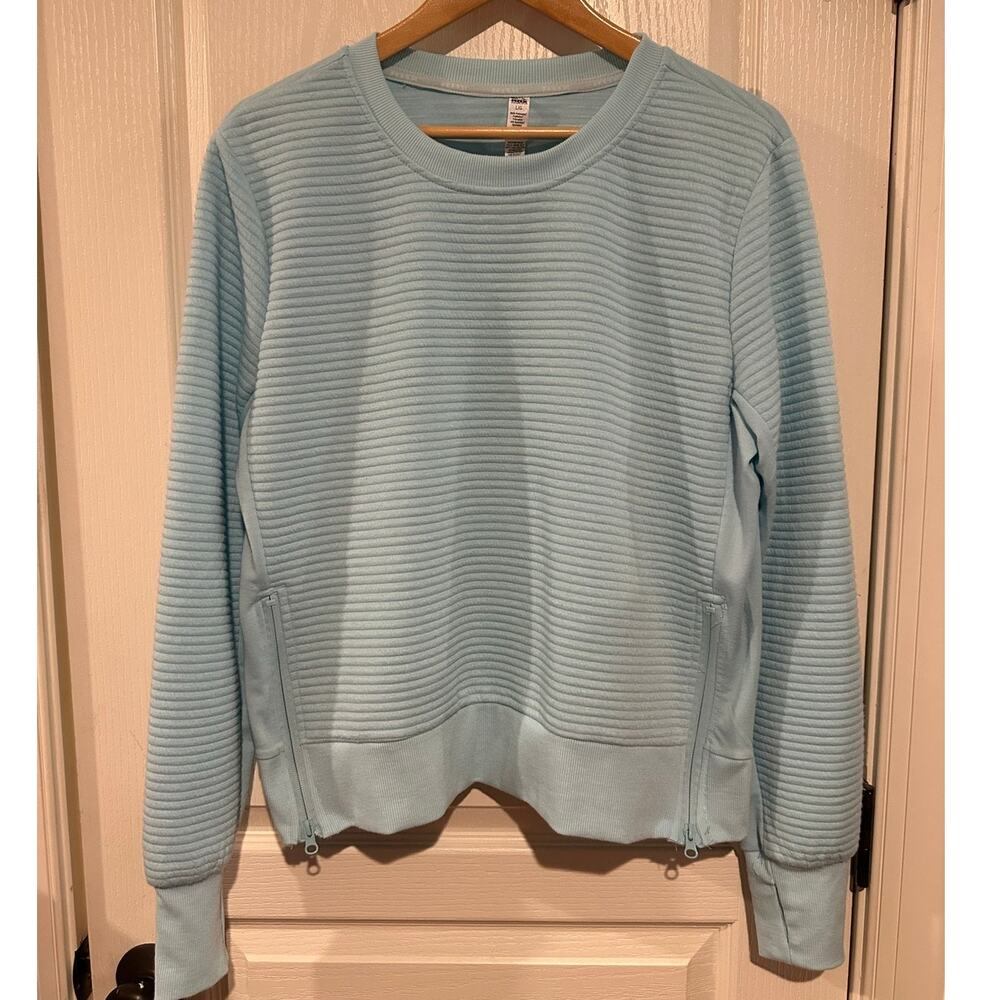 Women's RBX quilted style light blue sweatshirt Large zip sides